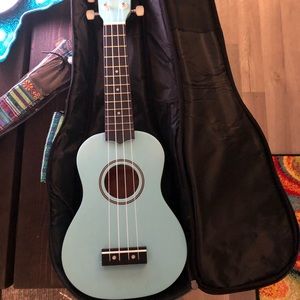 Ukulele-Soprano w/ bag, picks, beginners sheet music & Bob Marley sheet music!